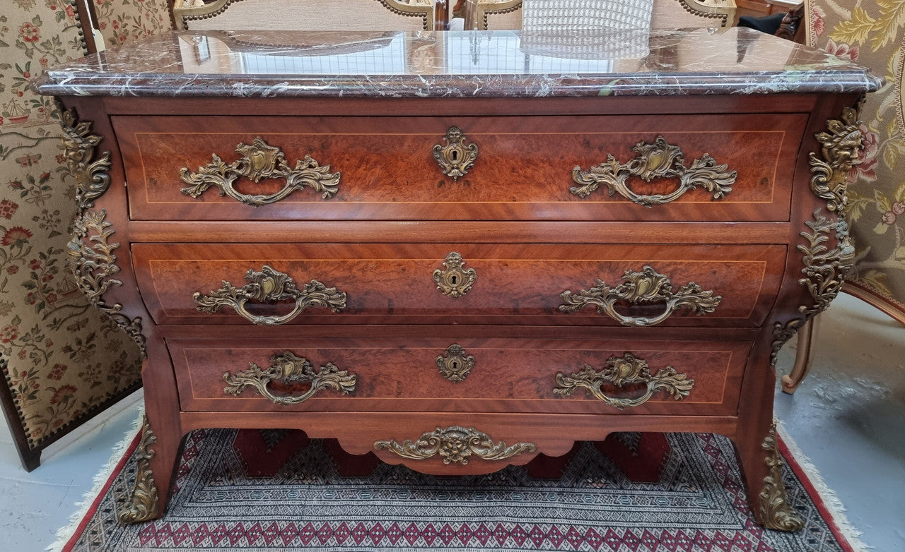 French Louis XVI style three drawer commode with amazing coloured marble. It has decorative brass mounts and is in very good original detailed condition.