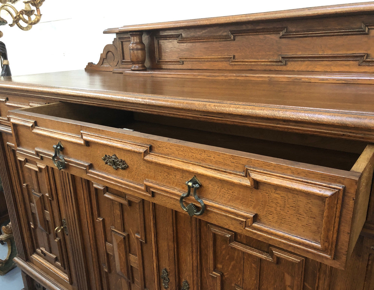 Beautiful carved French Oak four-door buffet with three drawers and lots of room for storage in good original detailed condition.