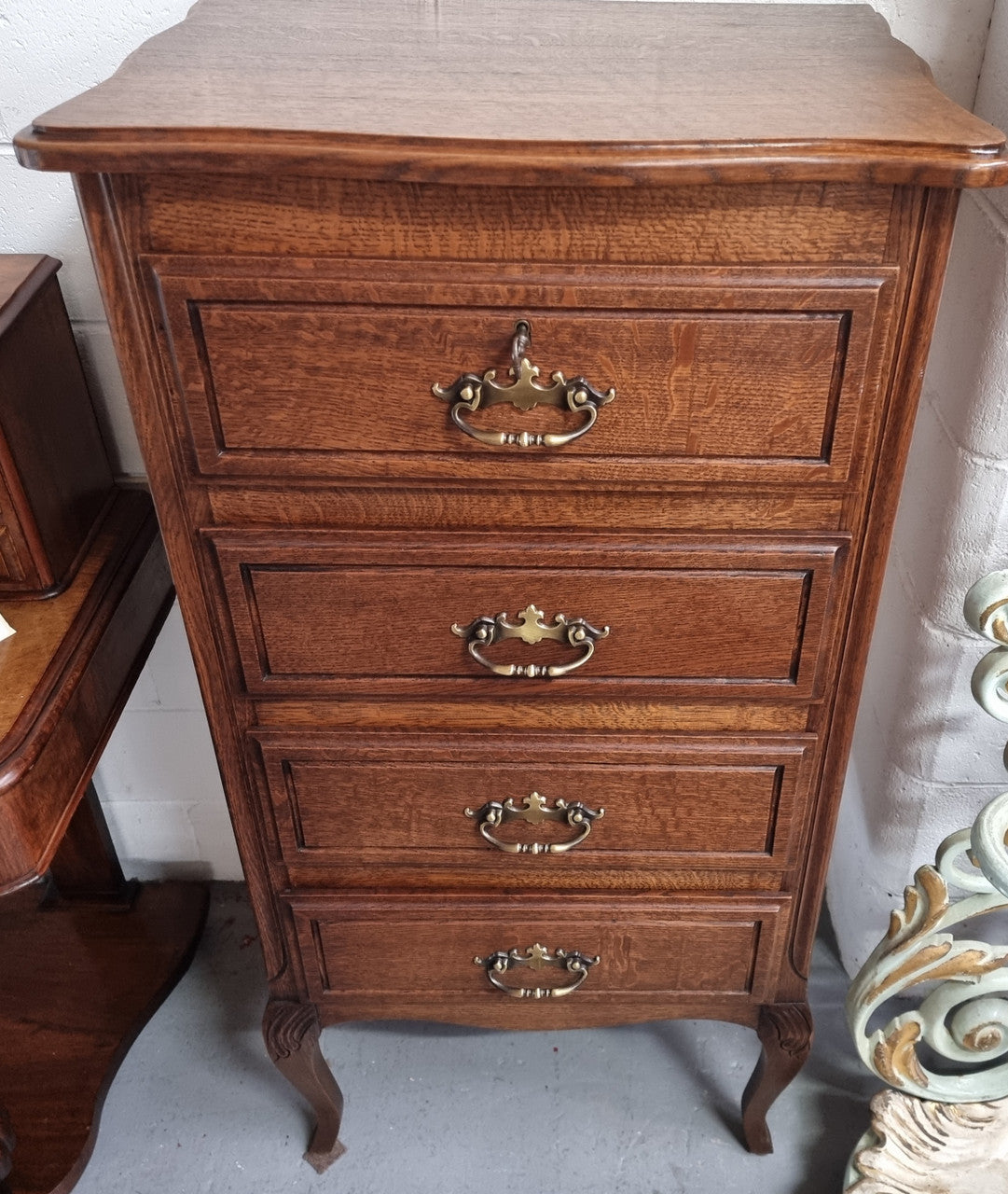 Elegant French Oak Louis XV style four drawer chest of drawers. It has lovely carvings and it is in good original detailed condition. It has been sourced from France.