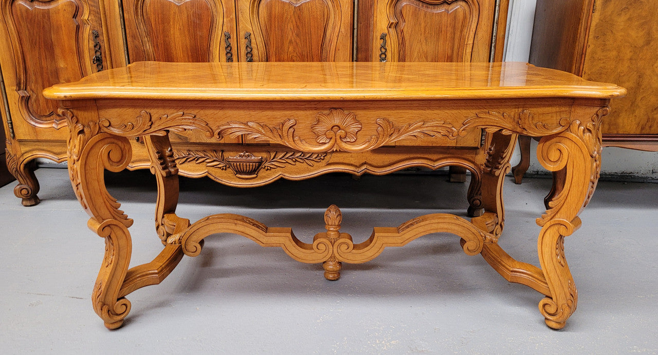 French Oak parquetry top coffee table with decorative carved base. It is in good original detailed condition.