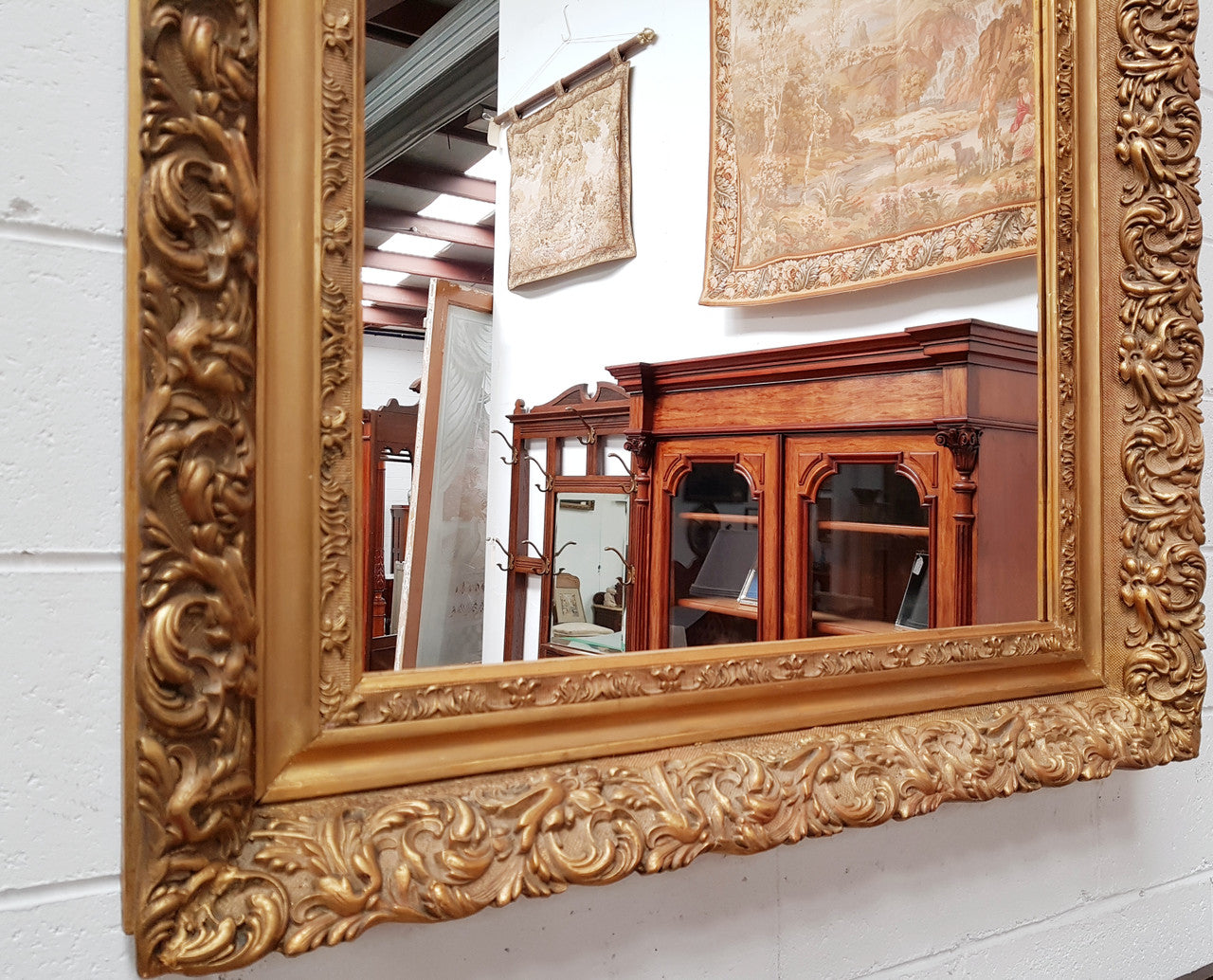 Large French Antique 19th century ornate gilt framed mirror. Circa 1880 and it is in very good original condition.