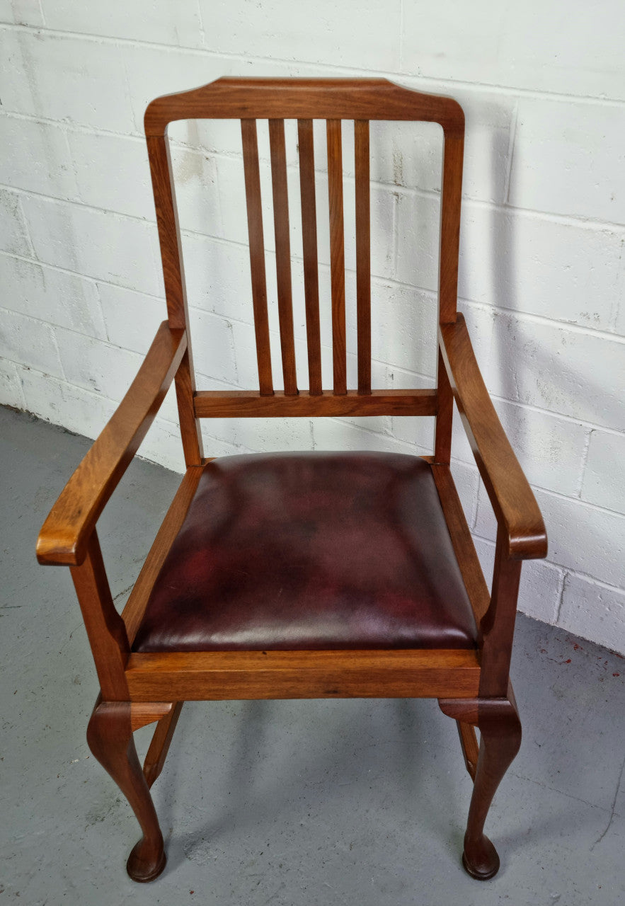 A very comfortable Black Wood Period leather seat armchair. In leather and chair are in good original condition.
