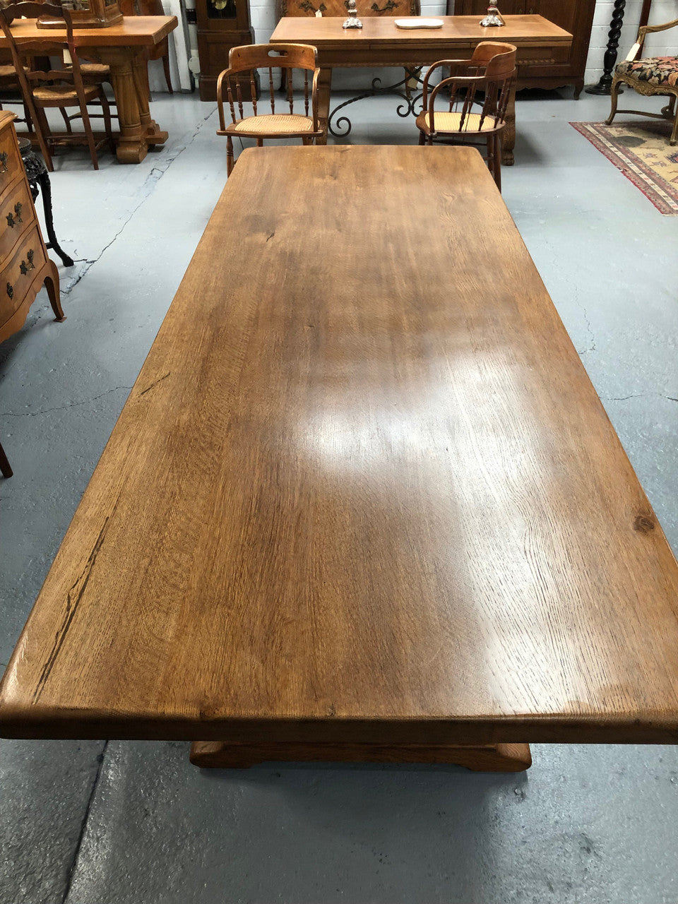 French oak fixed farmhouse table with a charming harp-shaped base. In good original condition and can seat 6-8 people. Circa 1930.