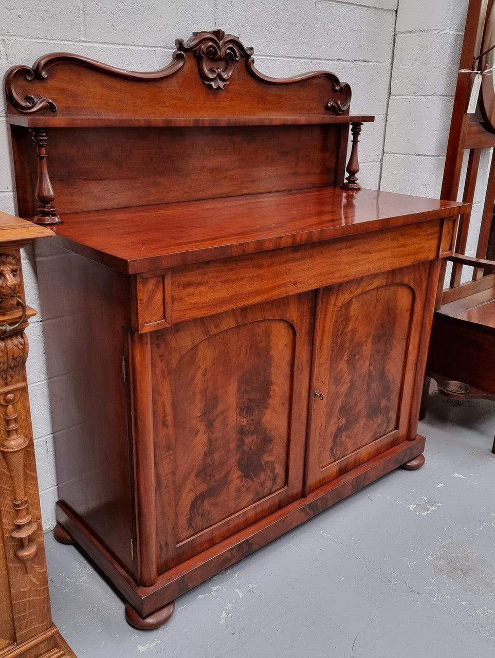 Beautiful Antique Rosewood Chiffonier with a cupboard, two doors and a drawer for all your storage needs . In good original detailed condition.