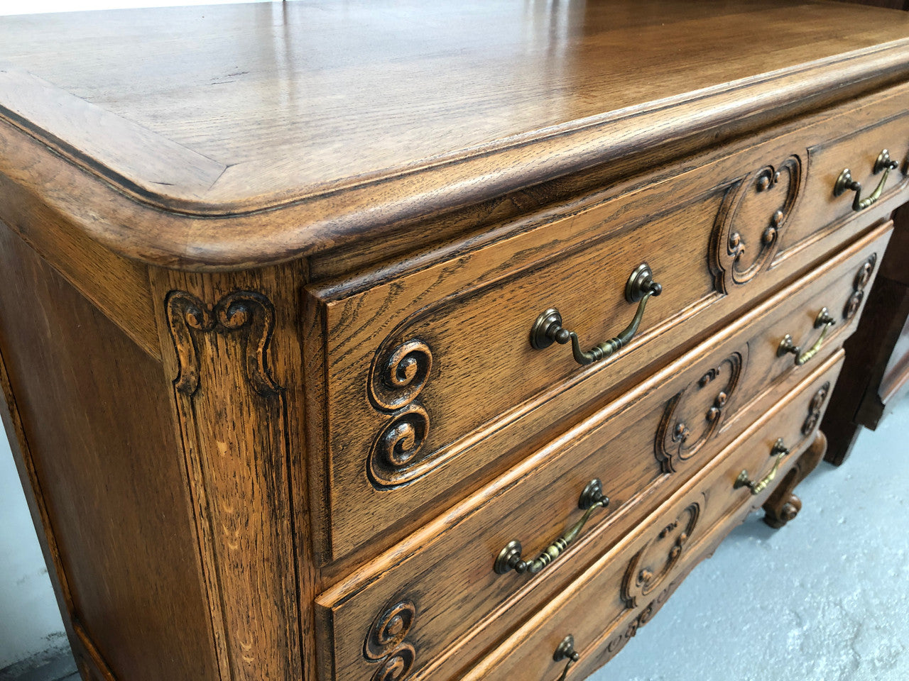 French nicely carved Oak chest of three drawers. In good original detailed condition.