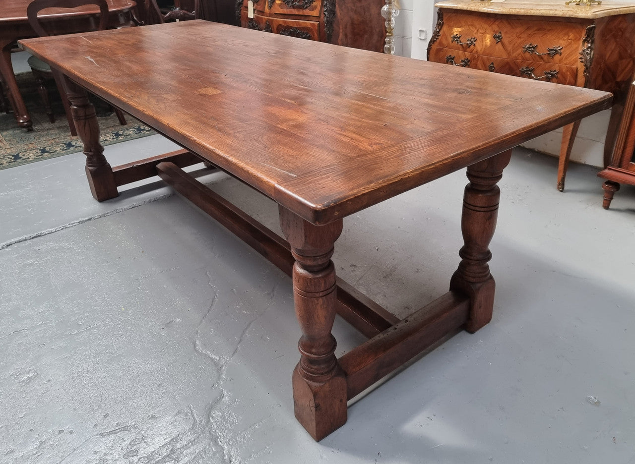 Vintage French Oak stretcher base farmhouse table. It is in good original condition.