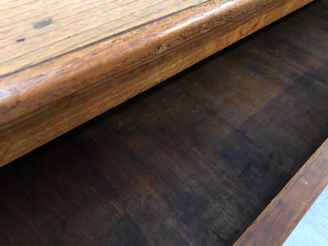 Lovely carved early 19th Century French Oak commode. There are three drawers with decorative drawer pulls and is in good original detailed condition.
