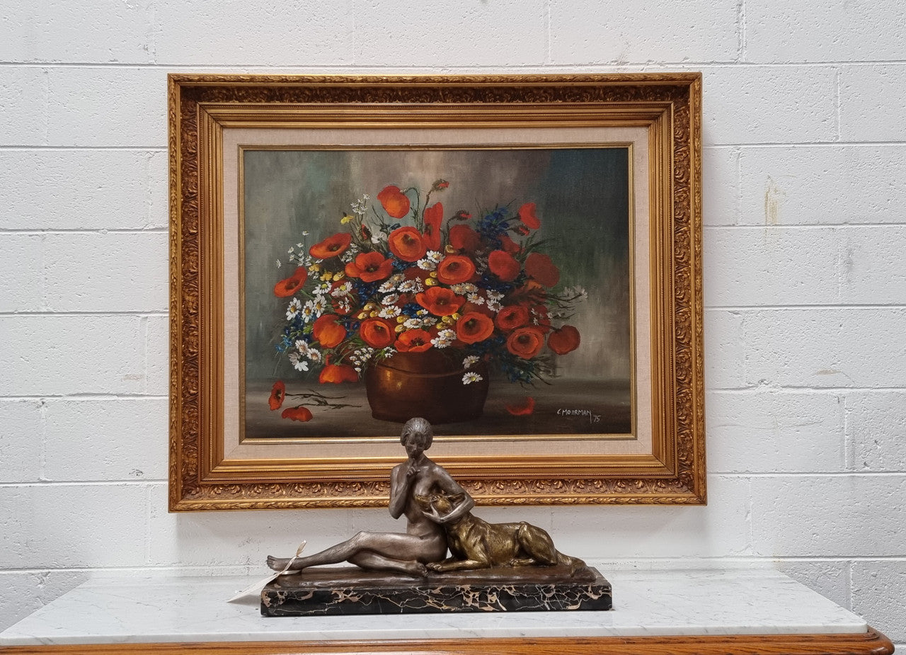 Lovely Vintage signed floral oil on canvas of Poppies and Daisy's and in a decorative gilt frame . In good original detailed condition.