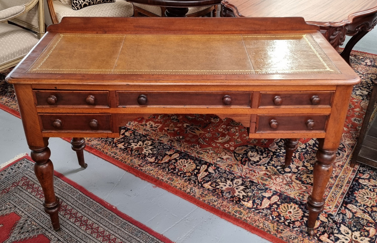 Lovely Victorian Cedar leather tooled top desk, with five drawers on castors and of pleasing proportions. In very good original detailed condition and has been sourced locally.