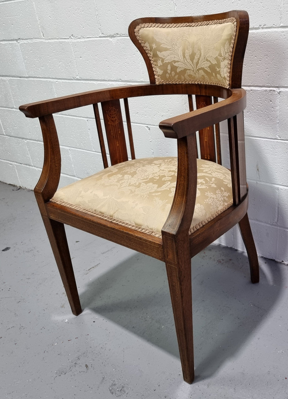 Charming Edwardian inlaid walnut upholstered armchair. In good original condition.