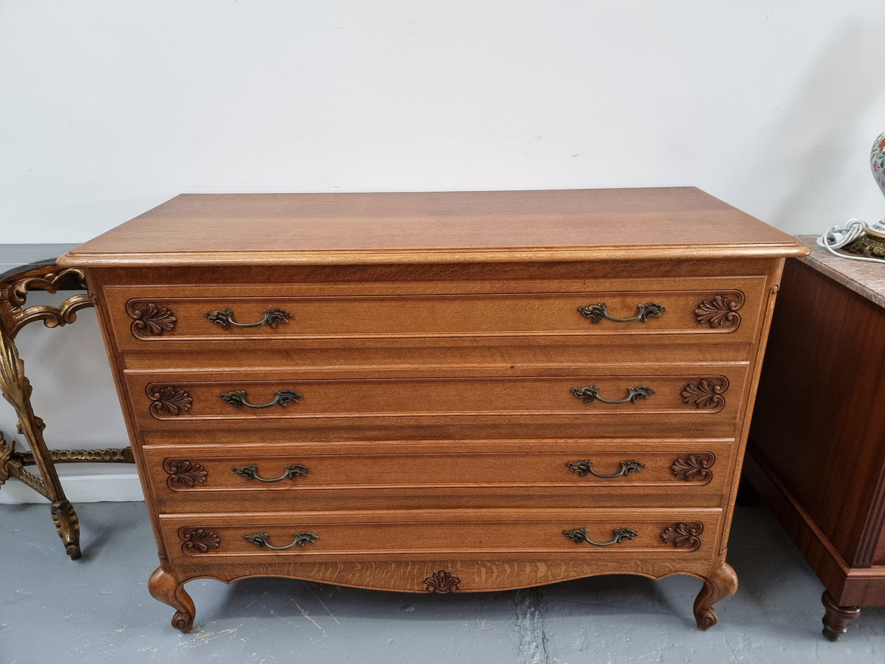 Fabulous French light Oak of chest of four drawers with lovely decorative carving. In good original detailed condition.