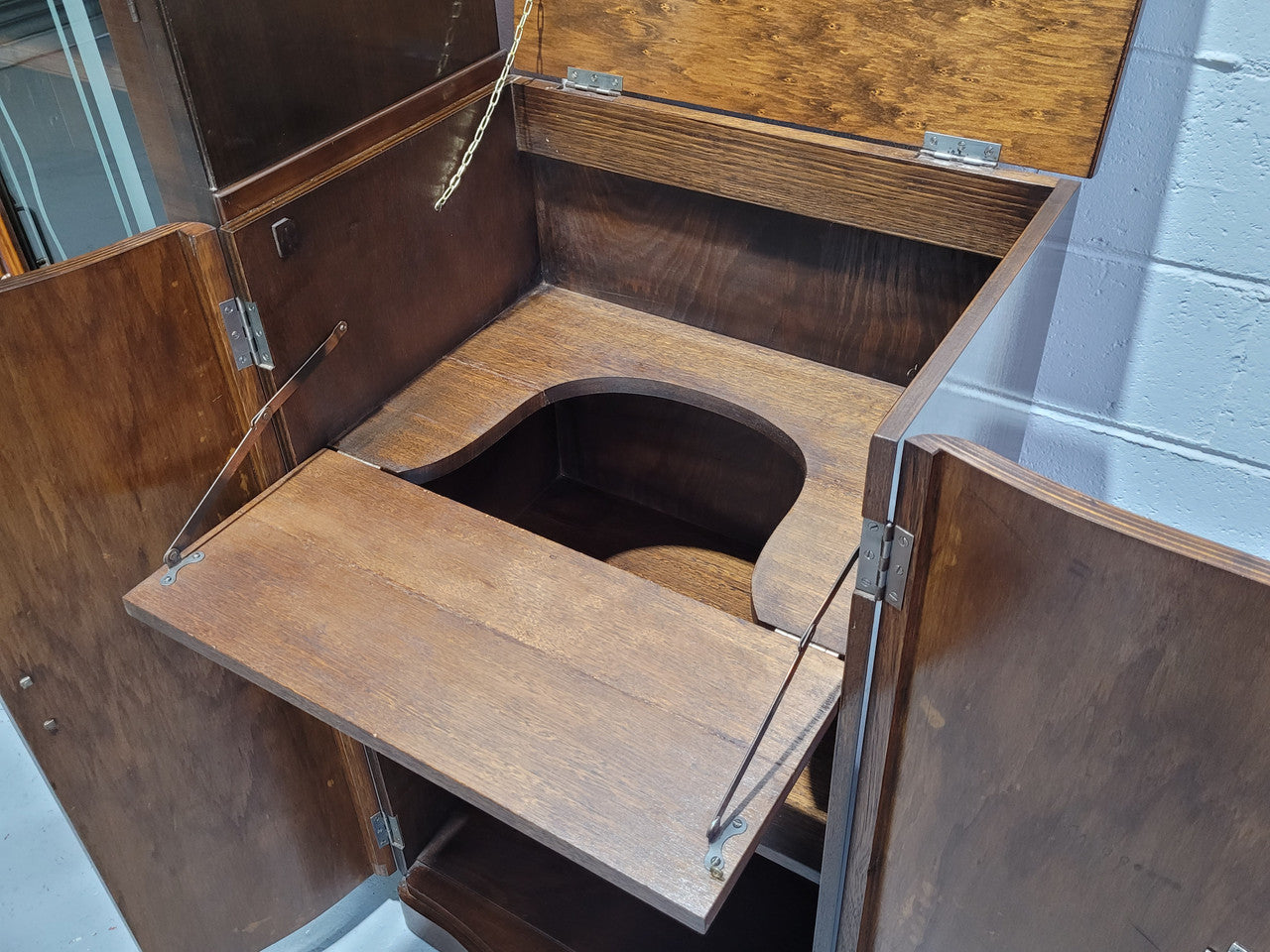 Art Deco Walnut display / drinks cabinet consisting of two glass door display and two door cupboard. Top section also lifts up and turns into a drinks area. All with original handles and in good original detailed condition.