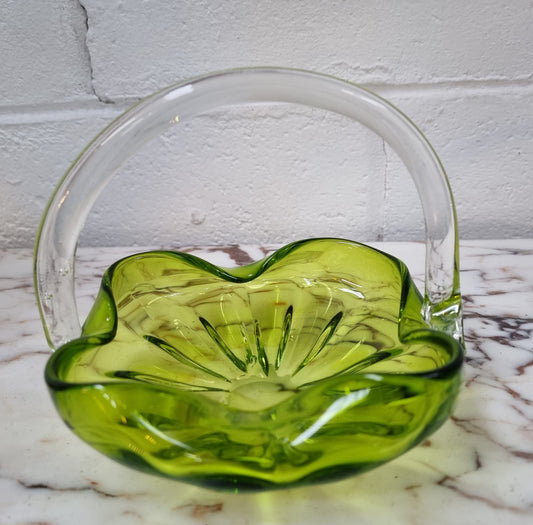 Delightful art glass vintage basket. Green glass bowl and clear handle.