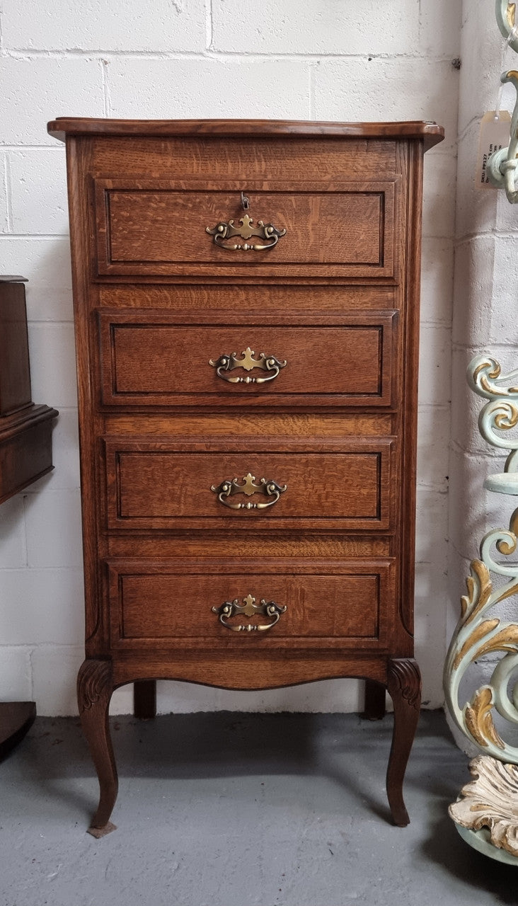 Elegant French Oak Louis XV style four drawer chest of drawers. It has lovely carvings and it is in good original detailed condition. It has been sourced from France.