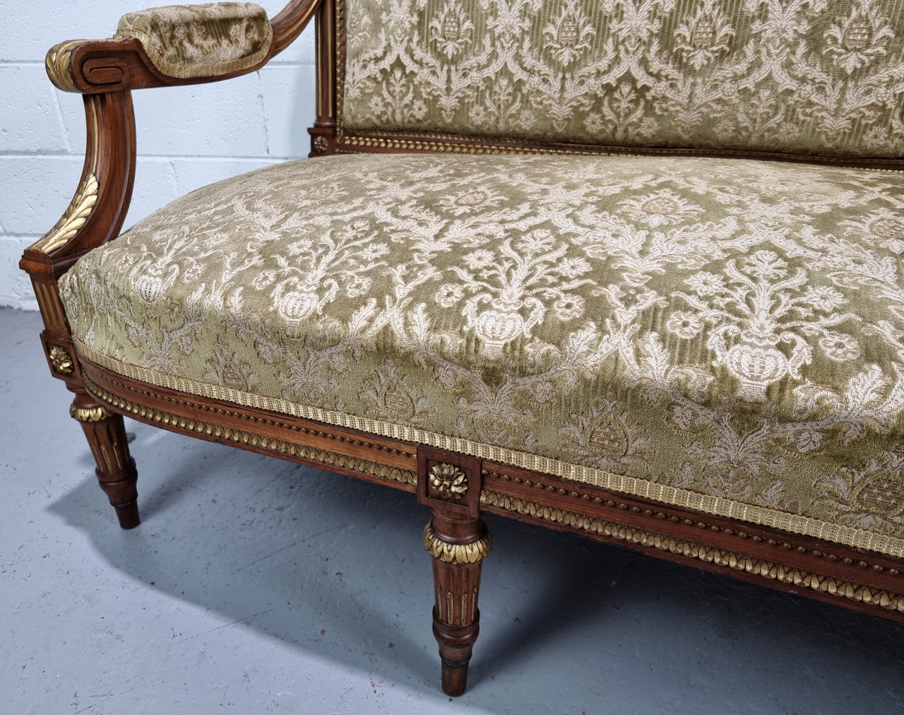 Beautiful French walnut Louis XVI style upholstered three piece Salon Suite. It has lovely fabric which is in overall good condition and is very comfortable to sit in. In good original detailed condition.