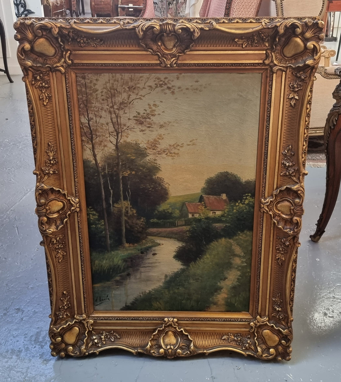 Lovely signed landscape river scene oil on canvas framed in a beautiful ornate frame and in good original condition.