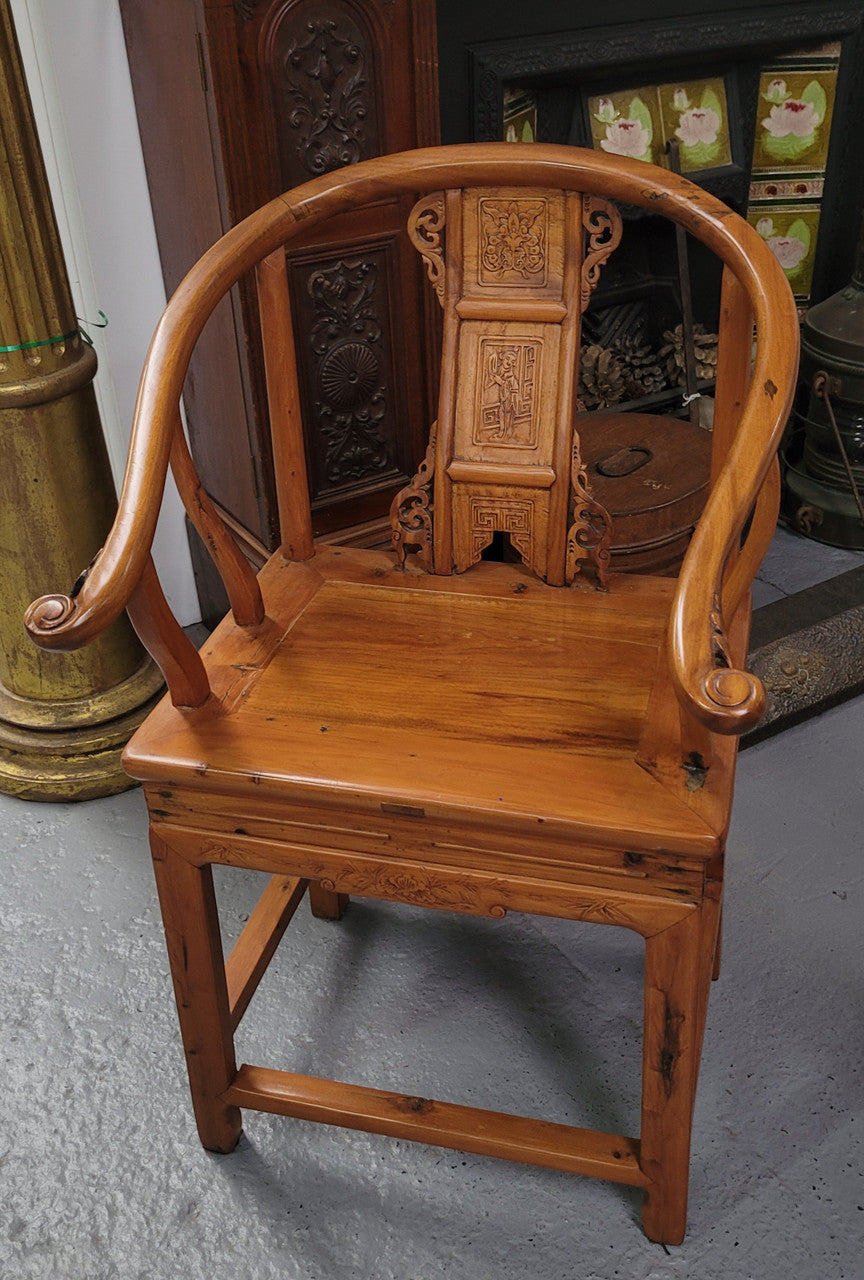 Lovely Chinese Elm horseshoe chair, featuring stunning carving and it is in good original detailed condition.