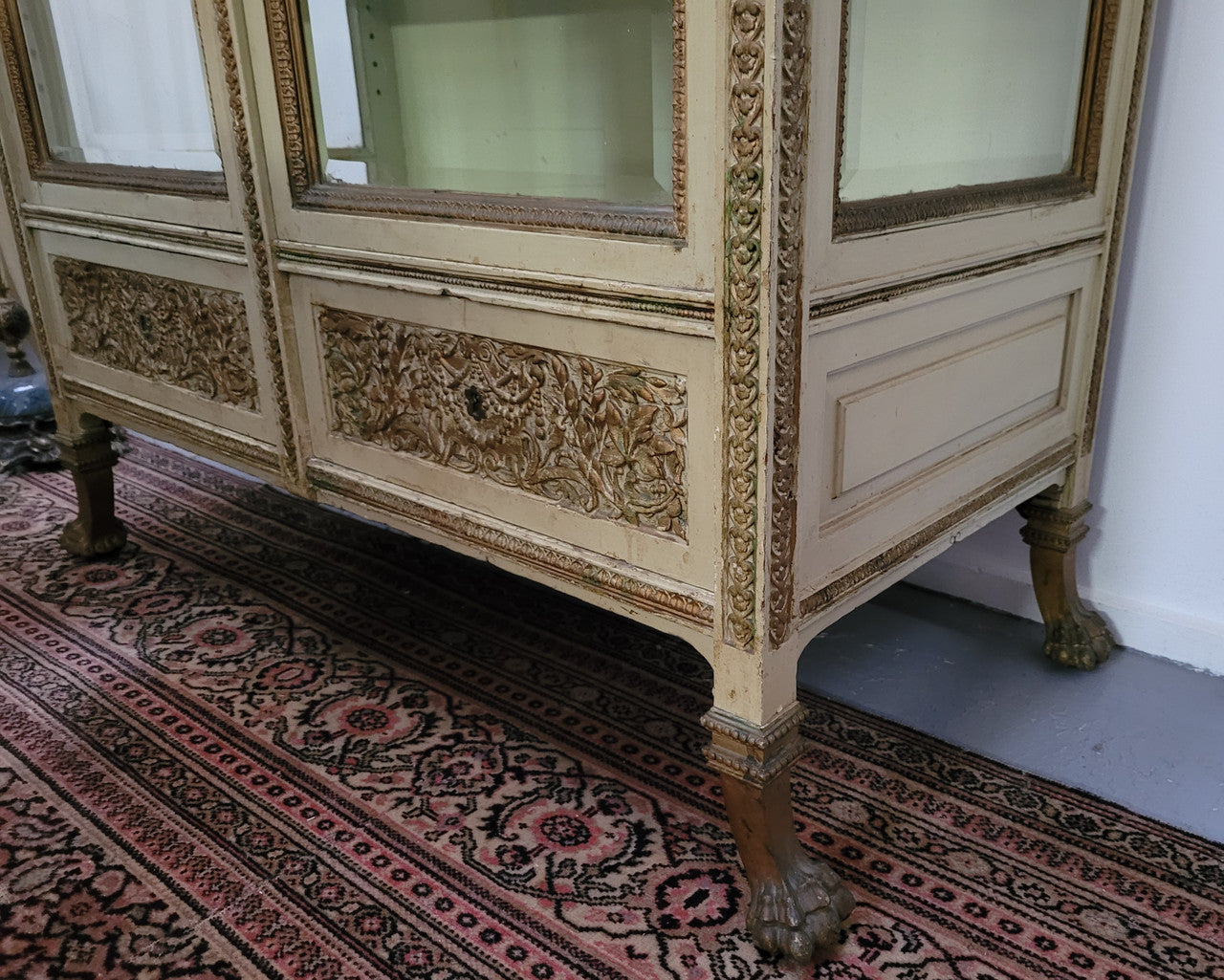 19th Century painted and gilt two door vitrine. Has one adjustable shelf and two drawers. In good original detailed condition.