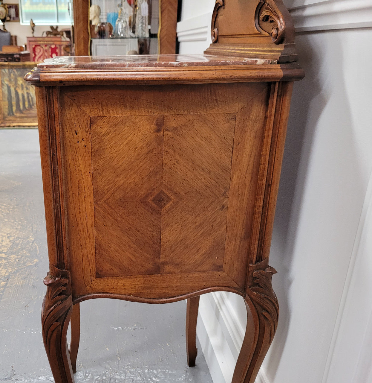 French Louis XV style Walnut single bedside cupboard with inset marble top. It has been sourced from France and is in good original detailed condition.