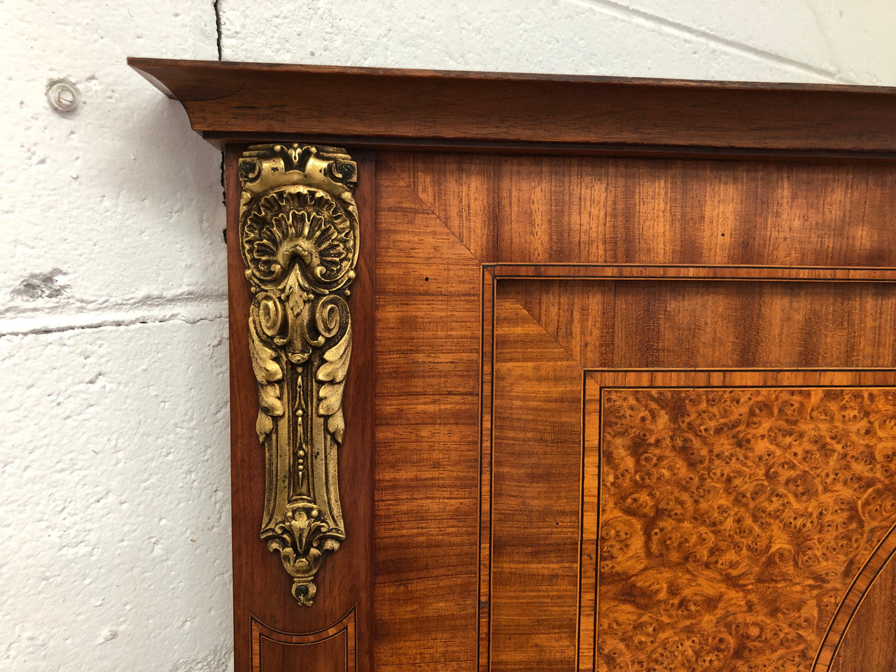 Beautiful Amboyna and Walnut Trumeau mirror. Has lovely parquetry inlay and is in good original condition.