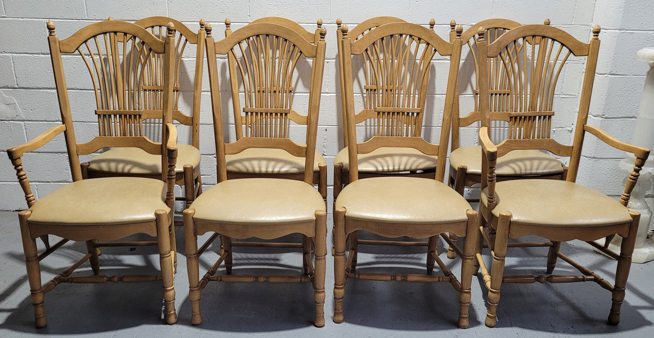 French country style set of six dining chairs and two carvers with leather seats. They are all in good original detailed condition.