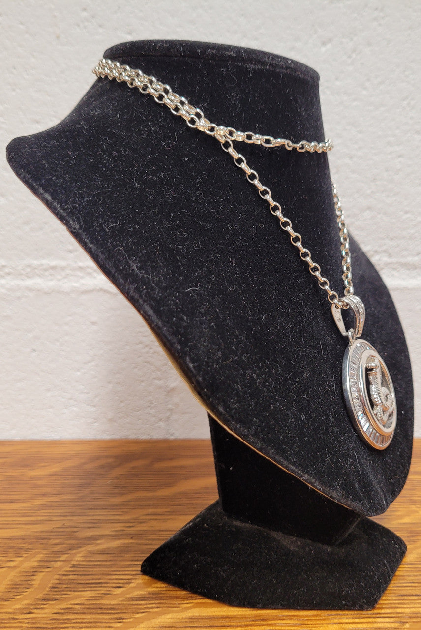 Sterling Silver pendant featuring a Cobra Snake with Cubic Zirconia surround. Heavy Bale with Cubic Zirconia. Pendant without Bale, 3.5cm Diameter. Includes 60 cm Sterling Silver Chain.