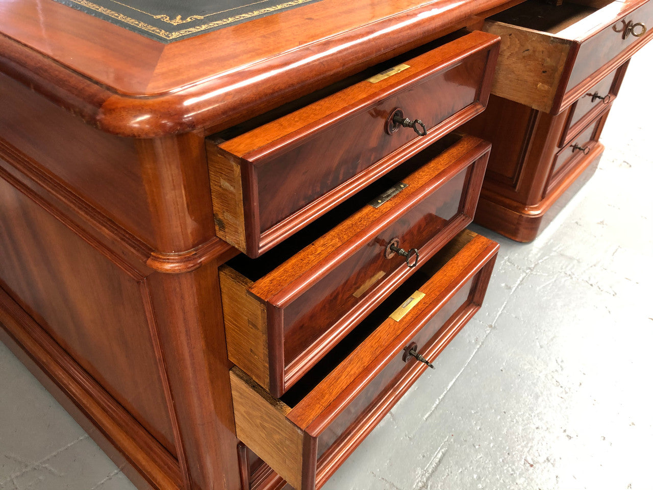 Antique French Mahogany and leather inset top double pedestal partners desk. Plenty of storage space with 9 long drawers on one side and space for someone to sit on the other side. In good restored condition. Circa 1880's.