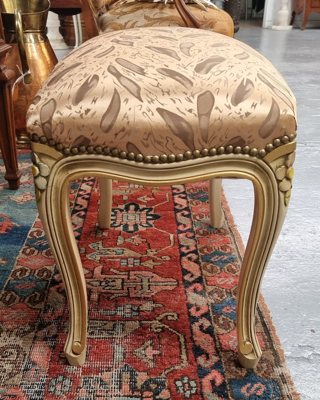 Appealing French Louis 15th style hand painted and gilded stool with good upholstery. In good original detailed condition.