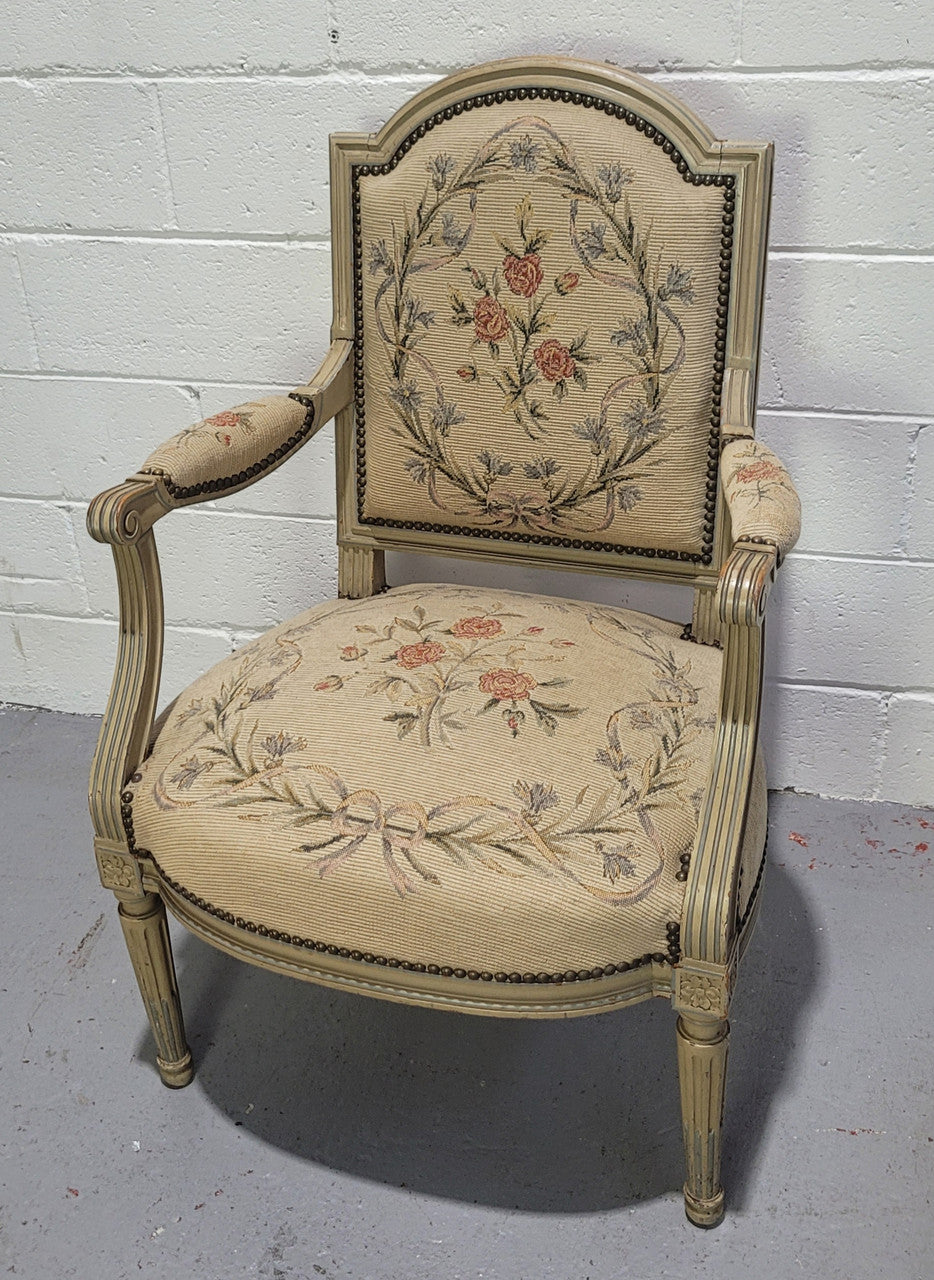 Lovely French Louis XVI style painted and Tapestry upholstered fauteuil. In good original condition, and very comfortable.