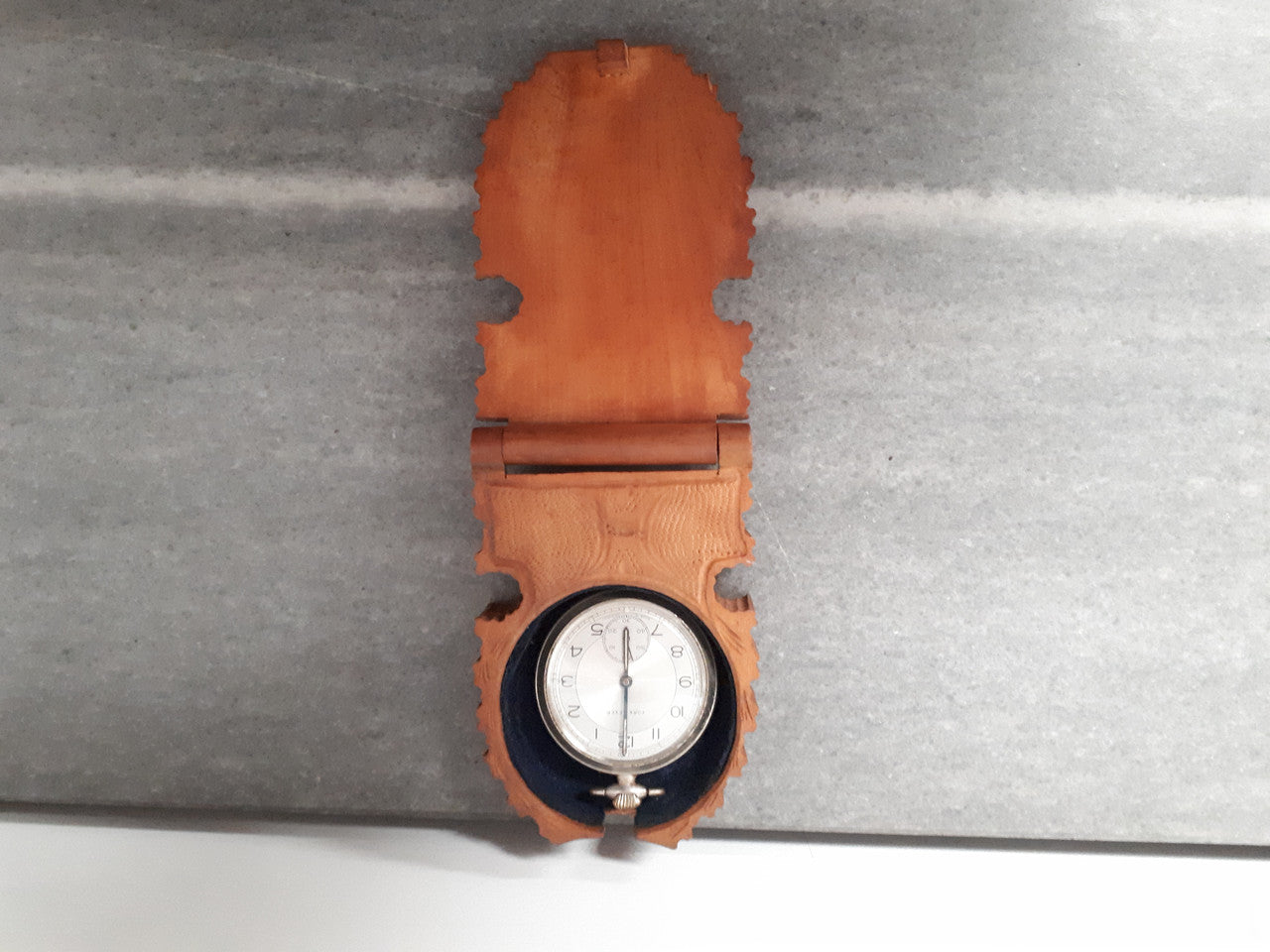 Antique hand carved black forest pocket holder & watch. Holder is circa 1910 and watch is circa 1930's.