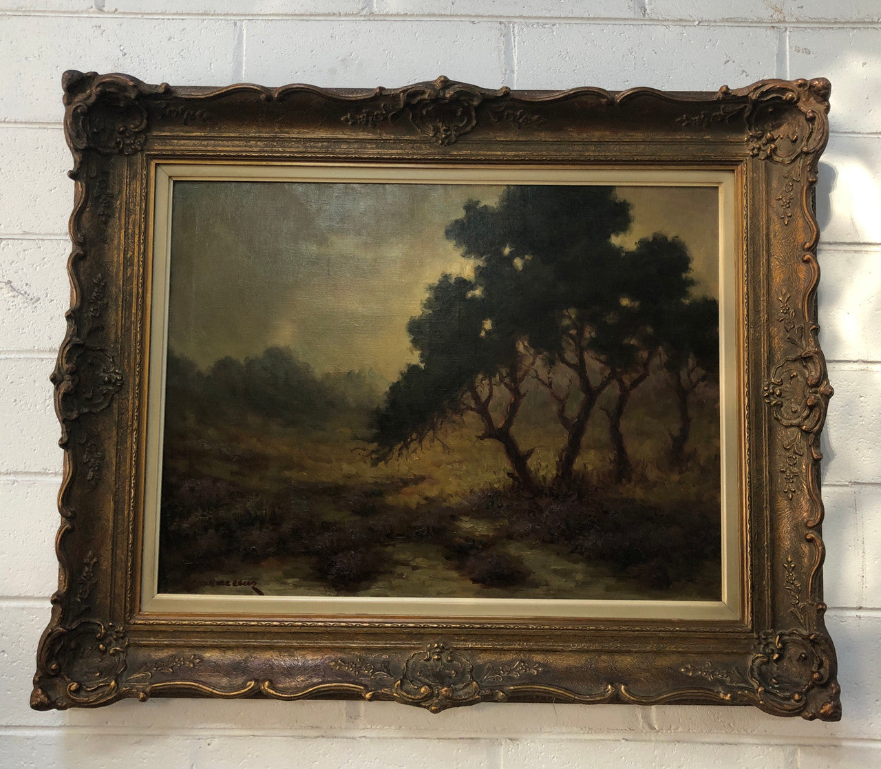 Sensational "Moody" oil on canvas landscape painting in a ornate gilt frame. In good original condition.