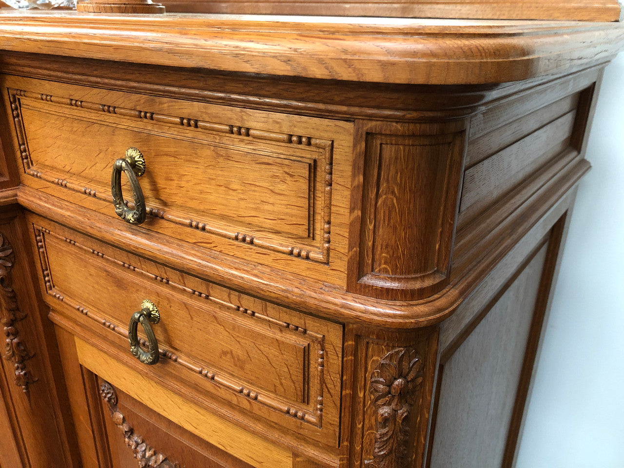 French Oak parquetry top sideboard with a glass top section for displaying and three cupboards and drawers for all your storage needs. Lovely carved details and is in good original detailed condition.