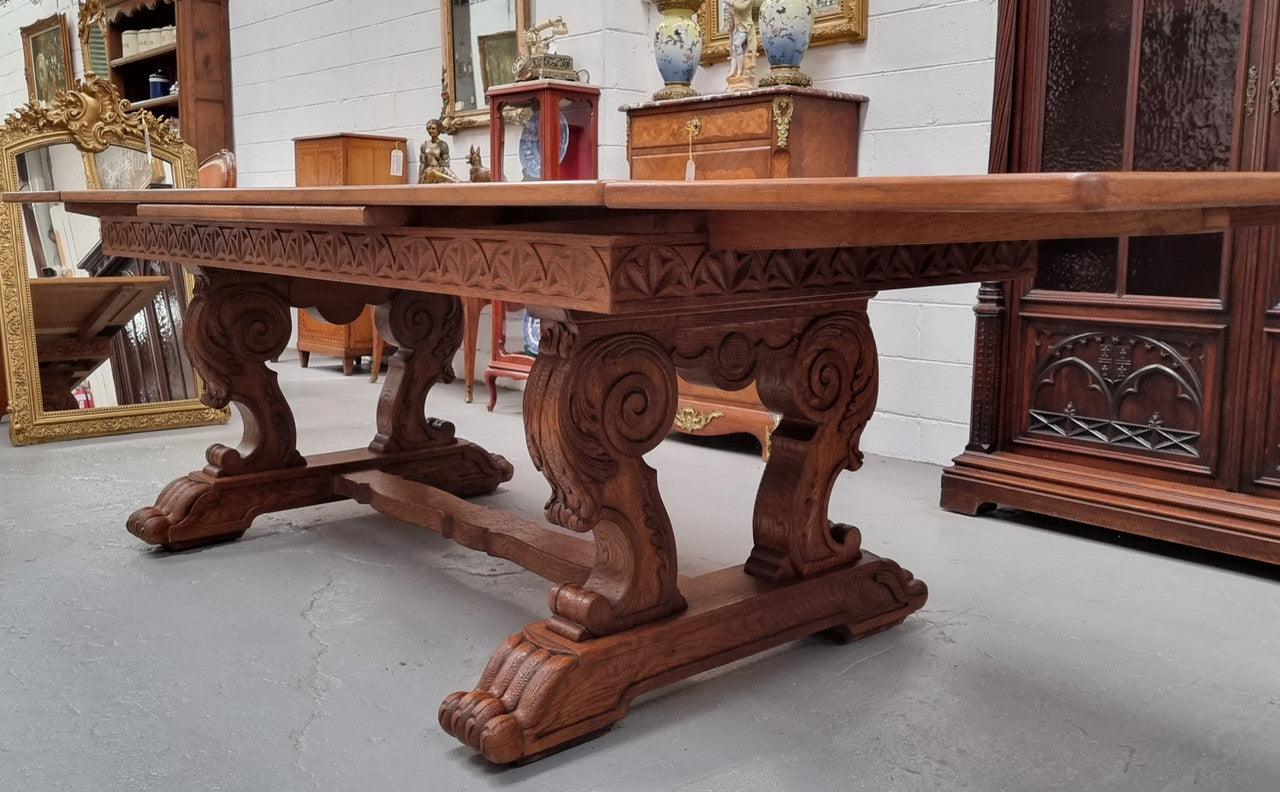 Amazing French Oak Renaissance style parquetry top extension table. Beautiful parquetry top and amazing detailed carvings on the legs. It extends to 306 cm long when fully extended. Sourced from France and in good original detailed condition.