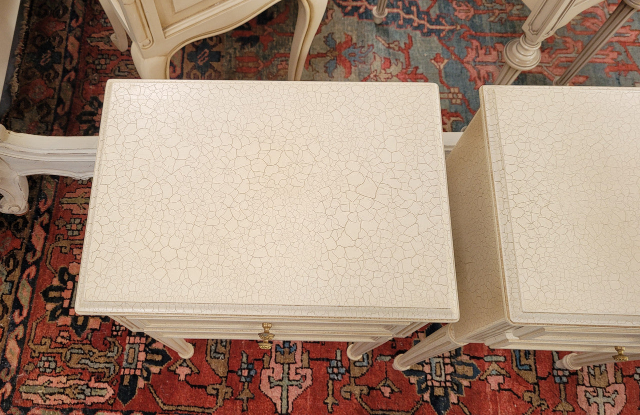 Pair of Vintage Louis 16th style painted crackle finish two drawer French style bedsides. They have elegant reeded legs and have been sourced from France. They are in good original condition.