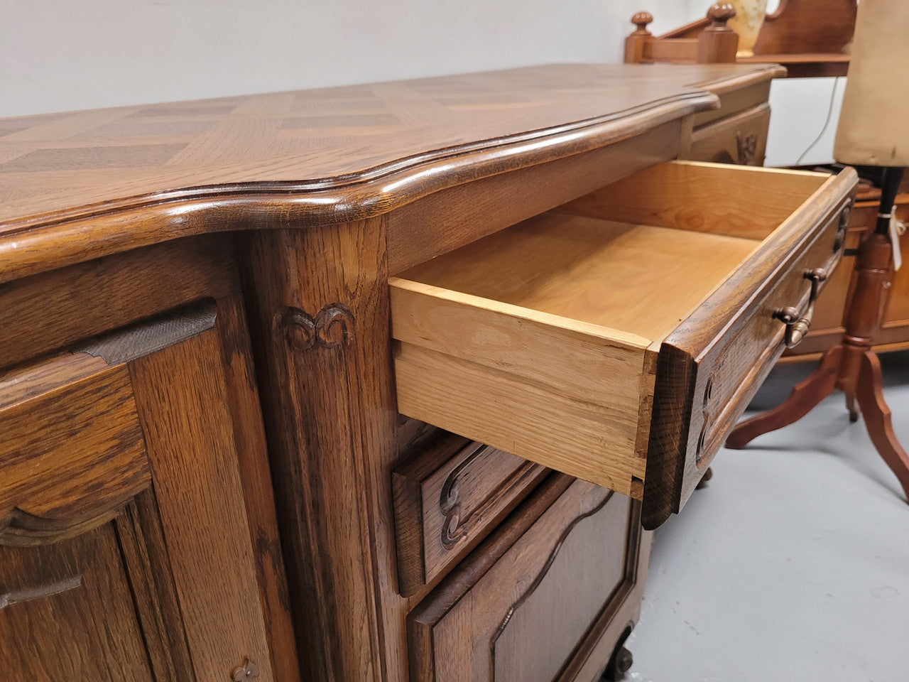 French Oak Louis XV style three door, two drawer, parquetry top sideboard. It has been sourced from France and is in good restored condition.