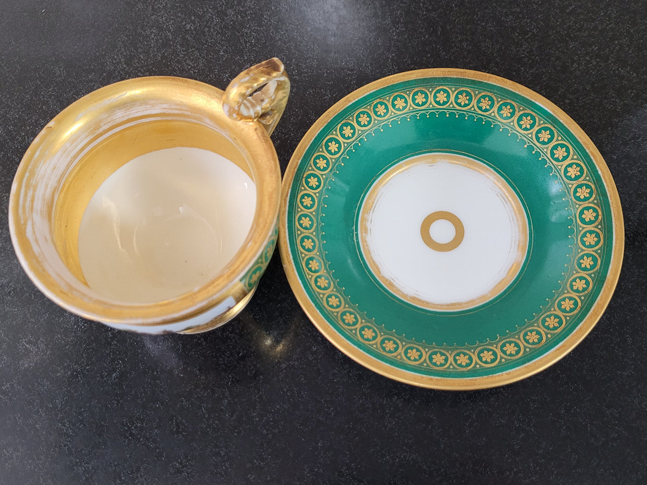 “Old Paris Porcelain” large cup and saucer with hand painted river landscape featuring castles. Gilt and enamel decoration. Circa: early 19th Century. In good original condition please view photos as they help form part of description.