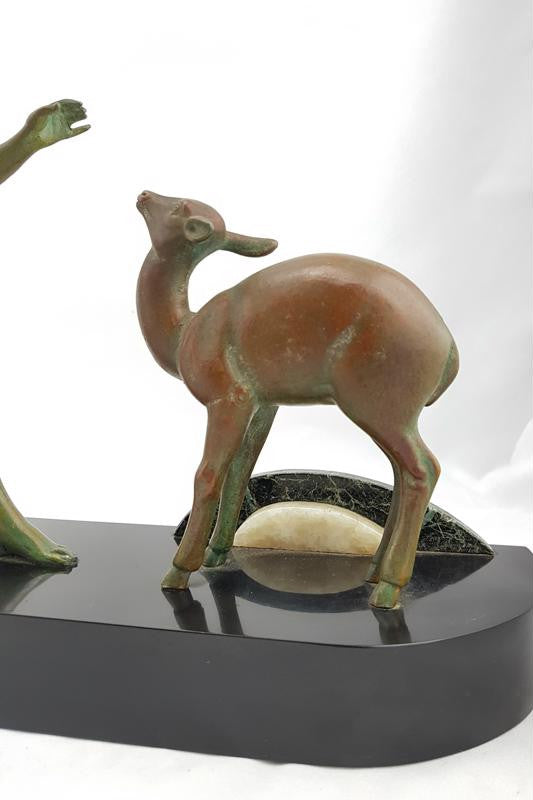 Absolutely gorgeous French cold painted metal Art Deco Statue of a lady and two deers on a marble base. Signed piece and in good original condition.