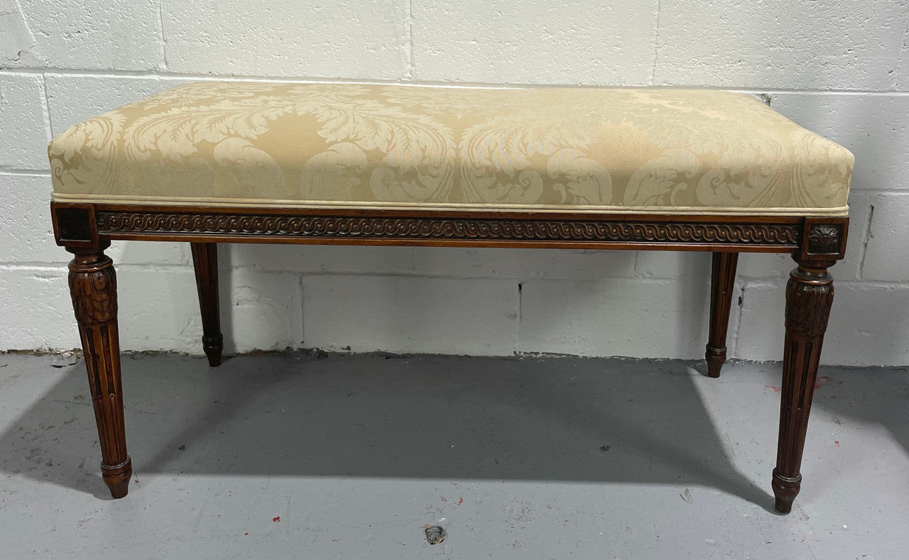 Nicely carved French Louis XVI style Walnut upholstered stool. The stool is in good condition and the frabic is in good used condition, please view photos as they help form part of the description.