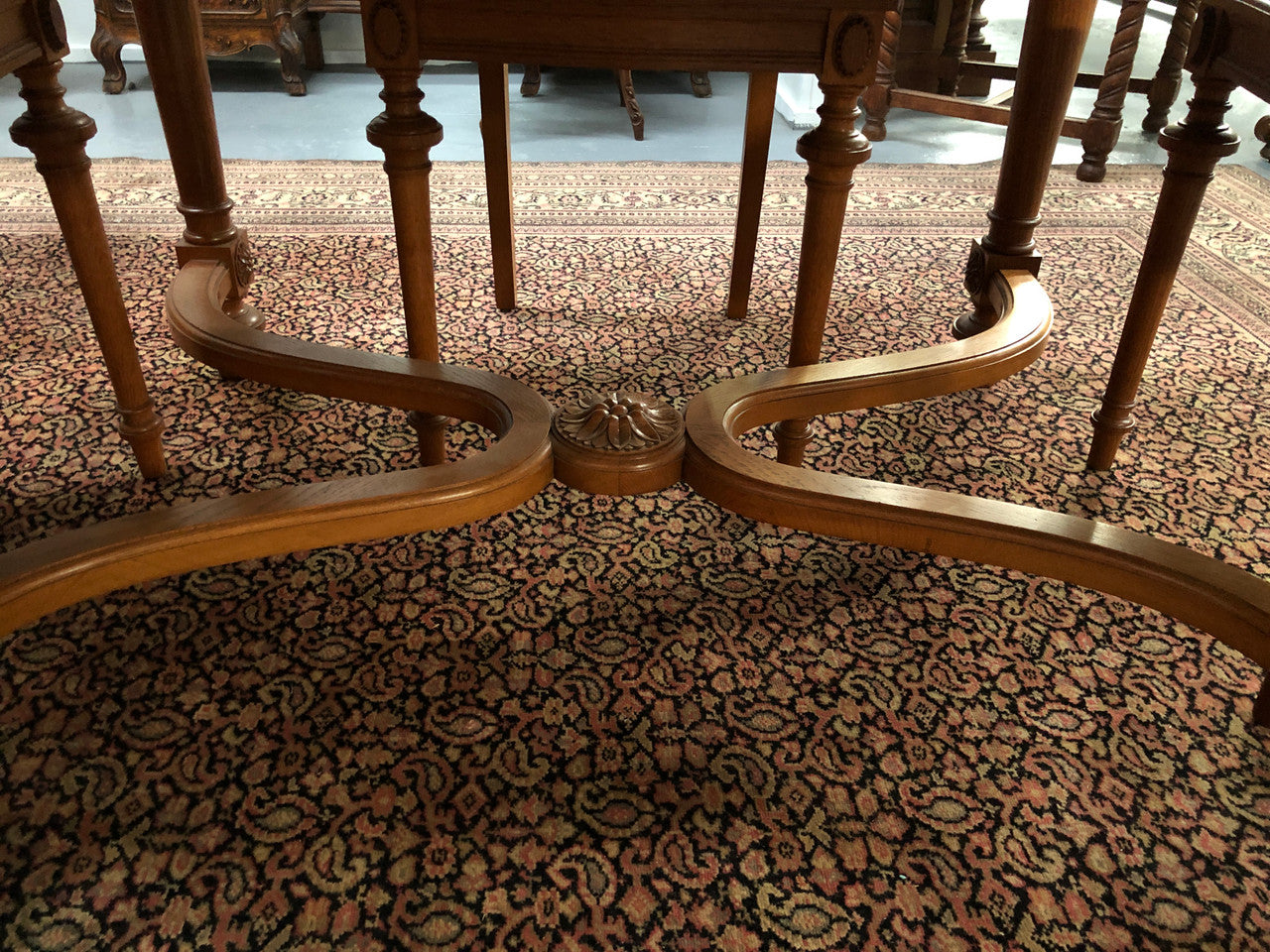 Lovely carved French Oak dining table with a parquetry top and six matching upholstered chairs in good original detailed condition.