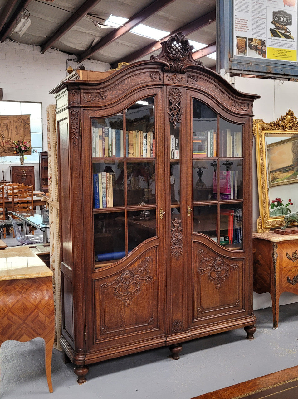 Substantial French Oak Louis 15th Style large two door bookcase. Adjustable shelves and very decorative carving. In good original detailed condition.
