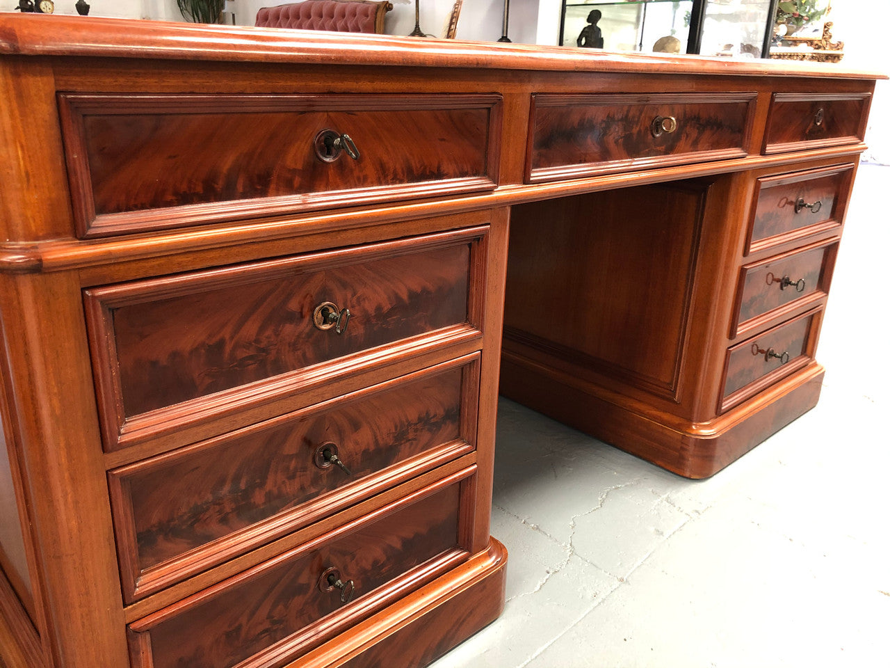 Antique French Mahogany and leather inset top double pedestal partners desk. Plenty of storage space with 9 long drawers on one side and space for someone to sit on the other side. In good restored condition. Circa 1880's.
