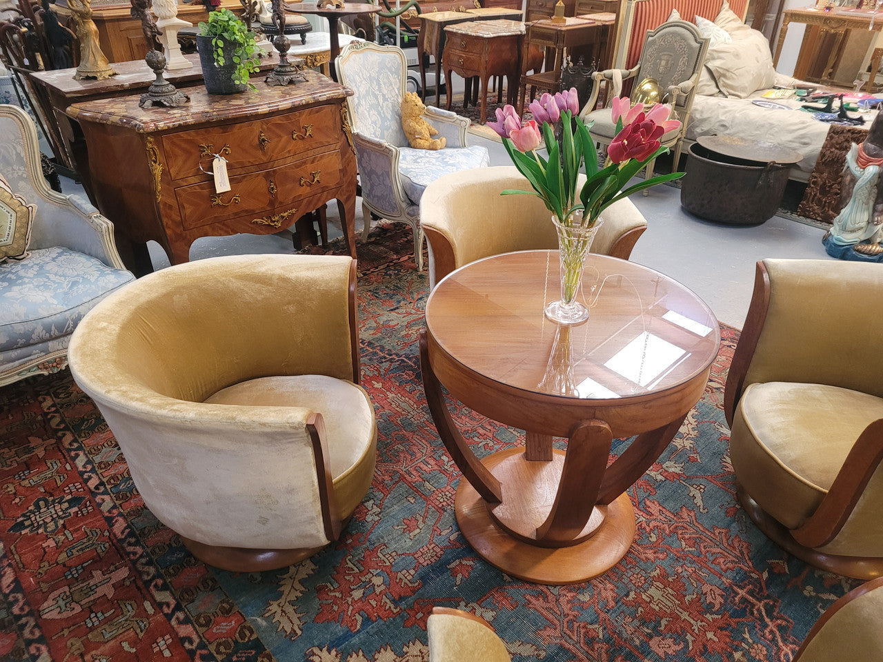Four stunning original Art Deco Tulip shaped salon lounge chairs made specifically for the Hotel Le Malandre, Belgium in the 1930’s. They are marked with a metal tag “Hotel Le Malandre Modele Depose” Burl Walnut, Walnut and gold coloured velvet upholstery and rest on a thick wooden circular base it has been sourced in France and in good original condition. Included in the set is the accompanying Art Deco Walnut with glass top side table also made for Hotel Le Malandre and marked with the metal tag. Absol