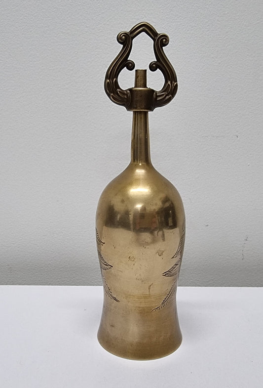 Vintage brass bell with incised decoration. It is in good original condition and has been sourced locally. Please view photos as they help form part of the description.