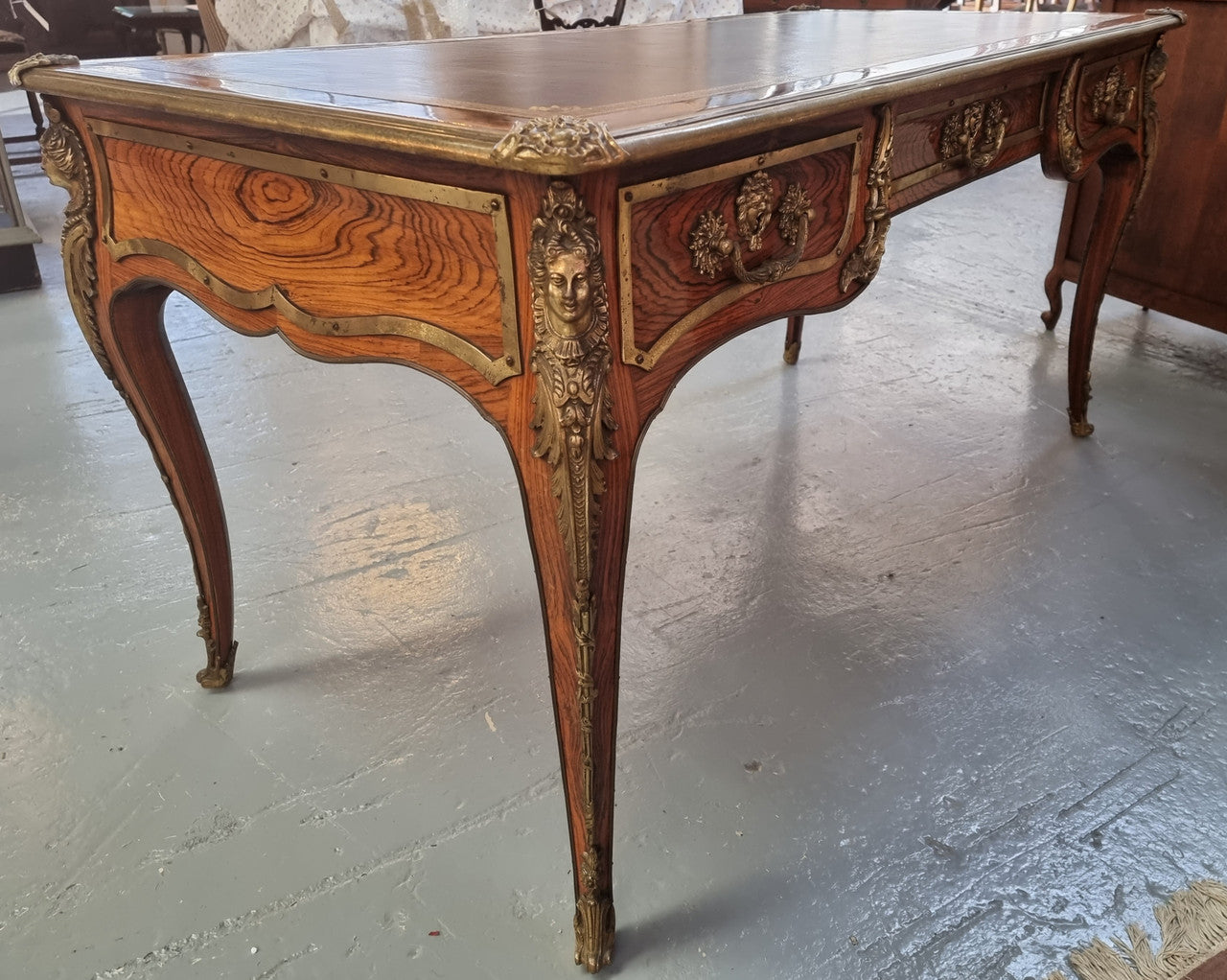 Beautifully fully restored French Antique Rosewood partners desk with beautiful ormolu detail and lovely tooled new leather top. There are three functioning drawers on one side for all your storage needs.