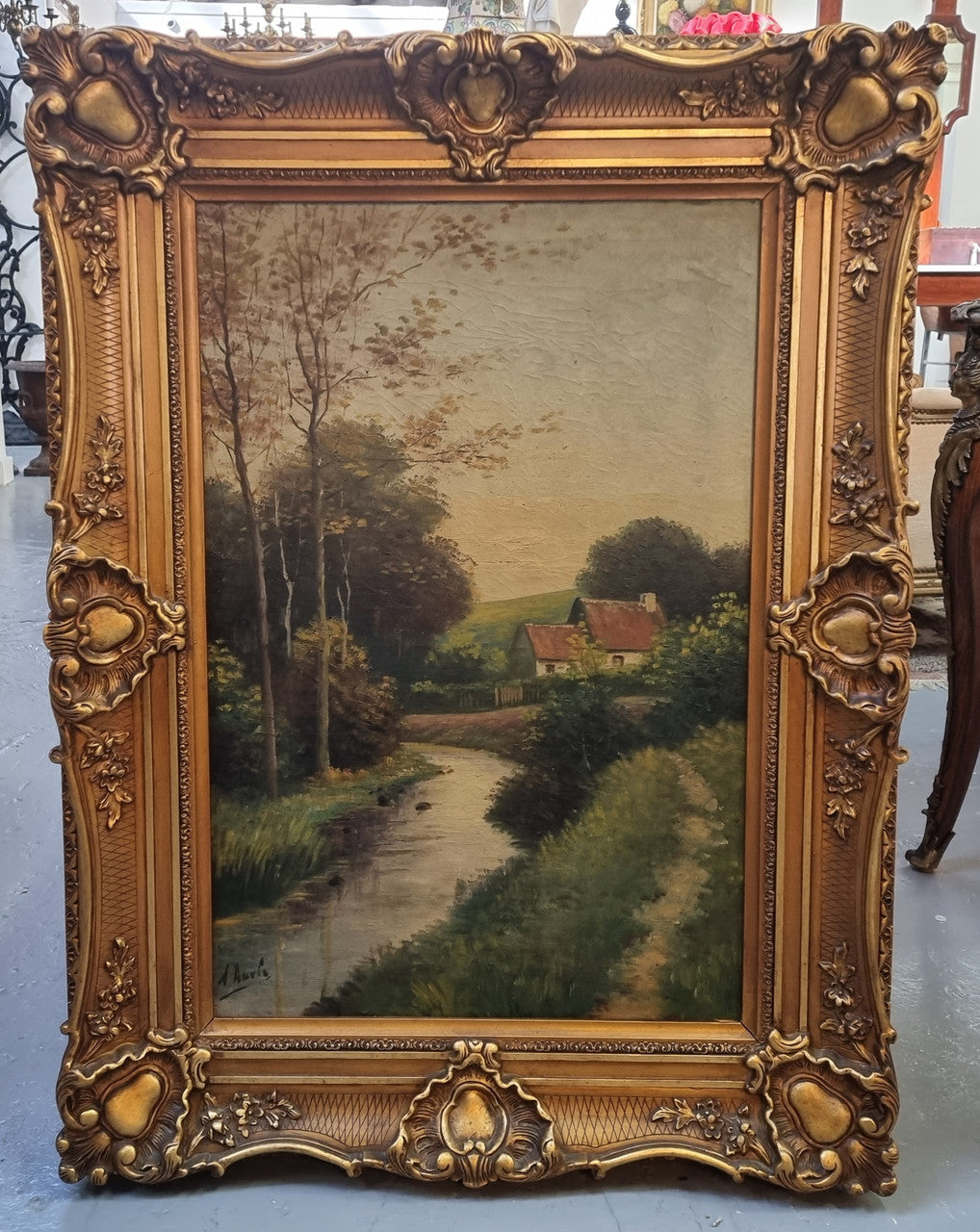 Lovely signed landscape river scene oil on canvas framed in a beautiful ornate frame and in good original condition.