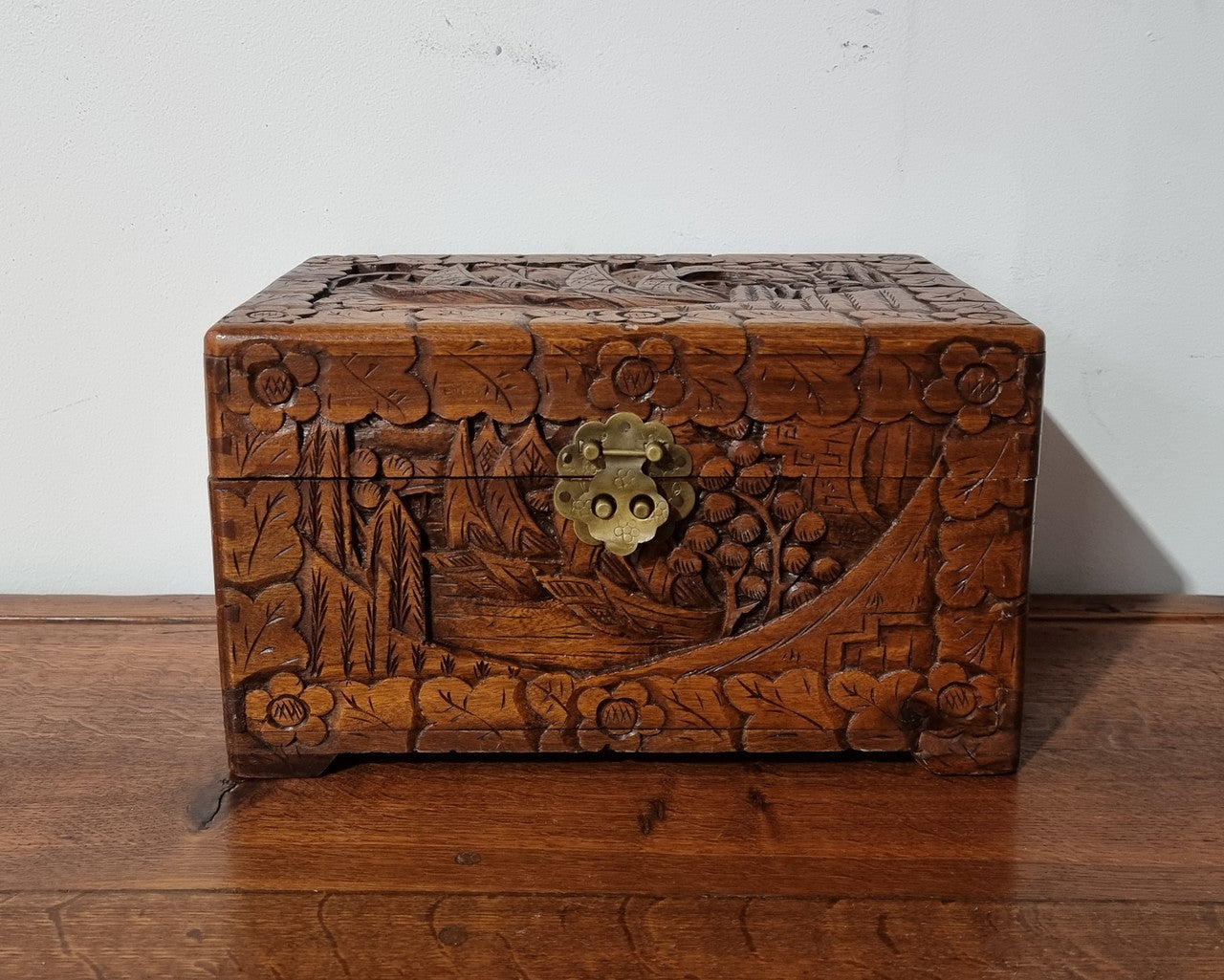 Small Chinese carved camphor wood jewellery box. It is in original condition.