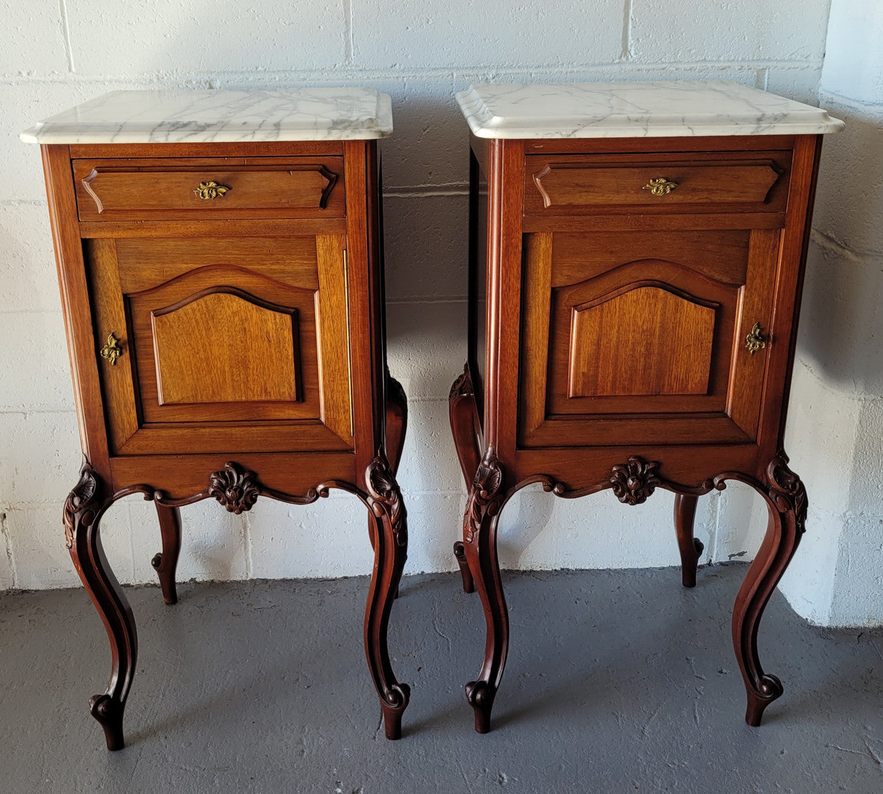 Pair of Louis XV style Walnut bedside cabinets marble top. Circa 1900 and in good original detailed condition.