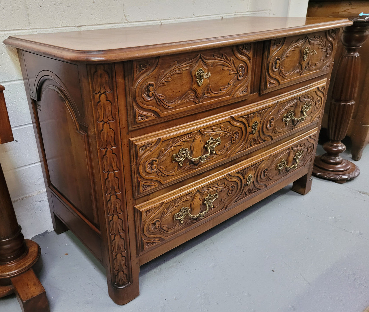 French Cherrywood Louis XIV style wooden topped chest of four drawers. It has been sourced from France and is in good original detailed condition.