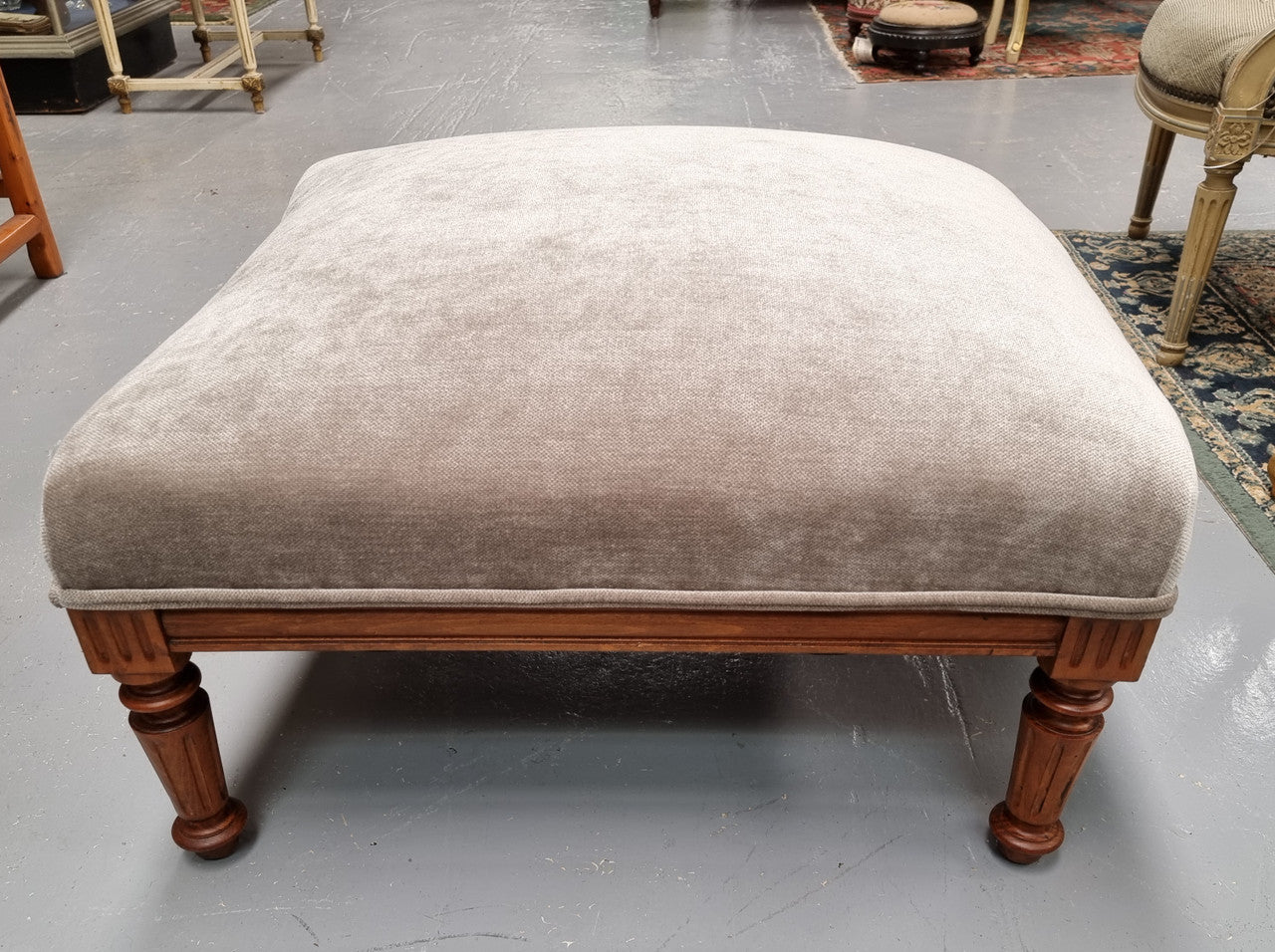 Lovely French Louis 16th style large walnut footstool with light grey upholstery. Circa:1900. In good detailed condition.