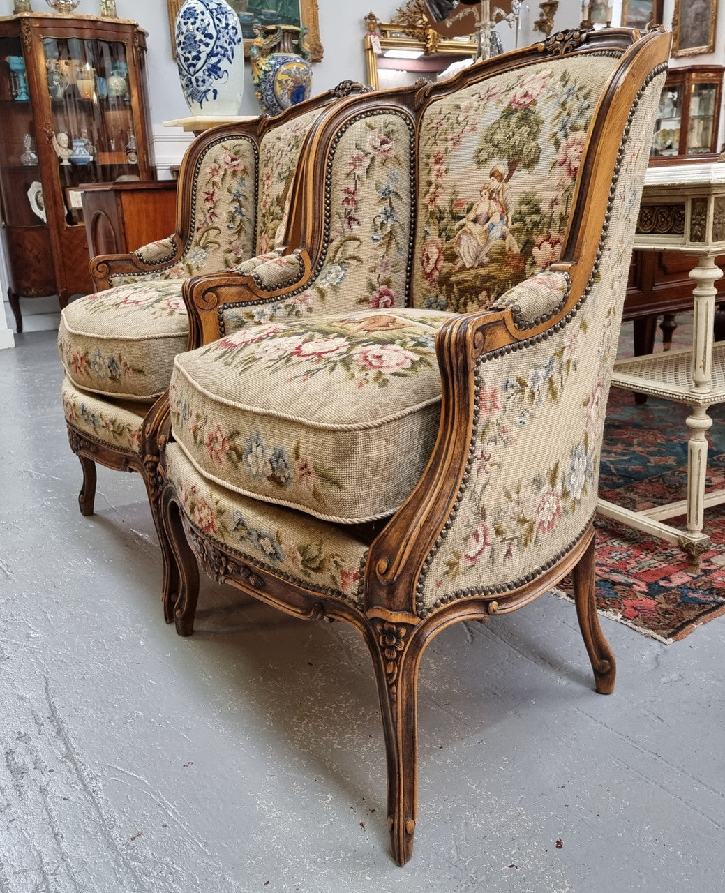Pair of amazing French Walnut tapestry covered armchairs. The tapestry is in very good condition, please view photos as they form part of the description. Sourced from France and is in good original detailed condition.